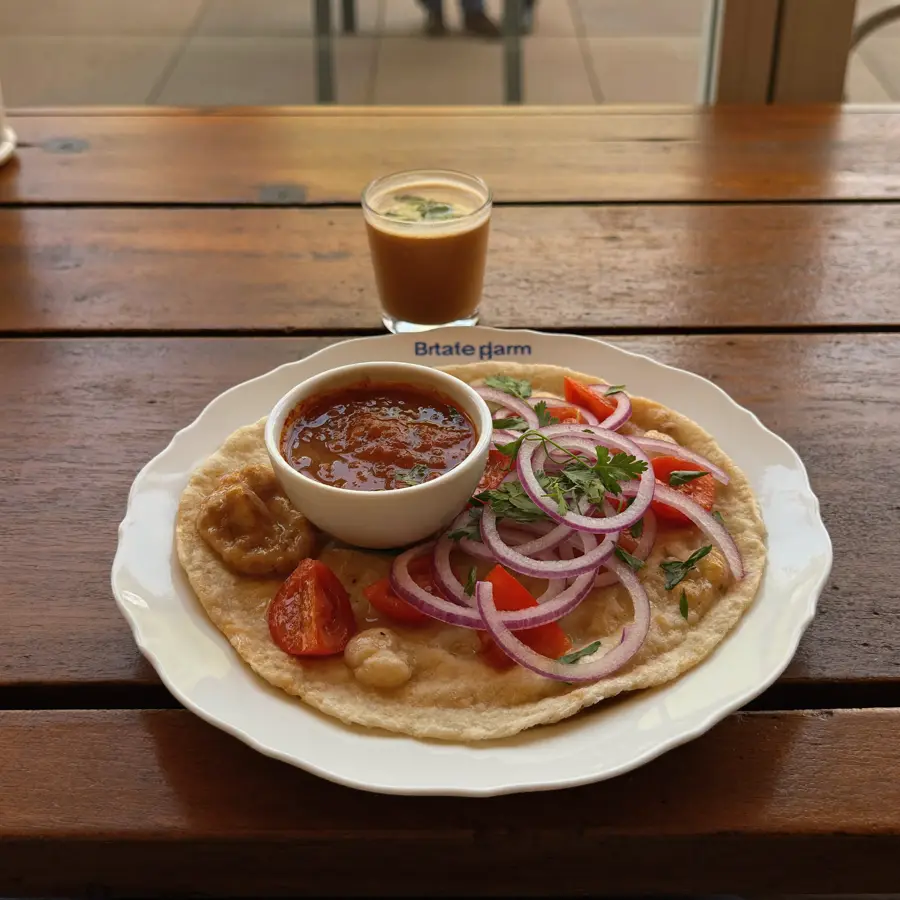 Onion Uttapam (served view) – pure veg from Mohit Bakery